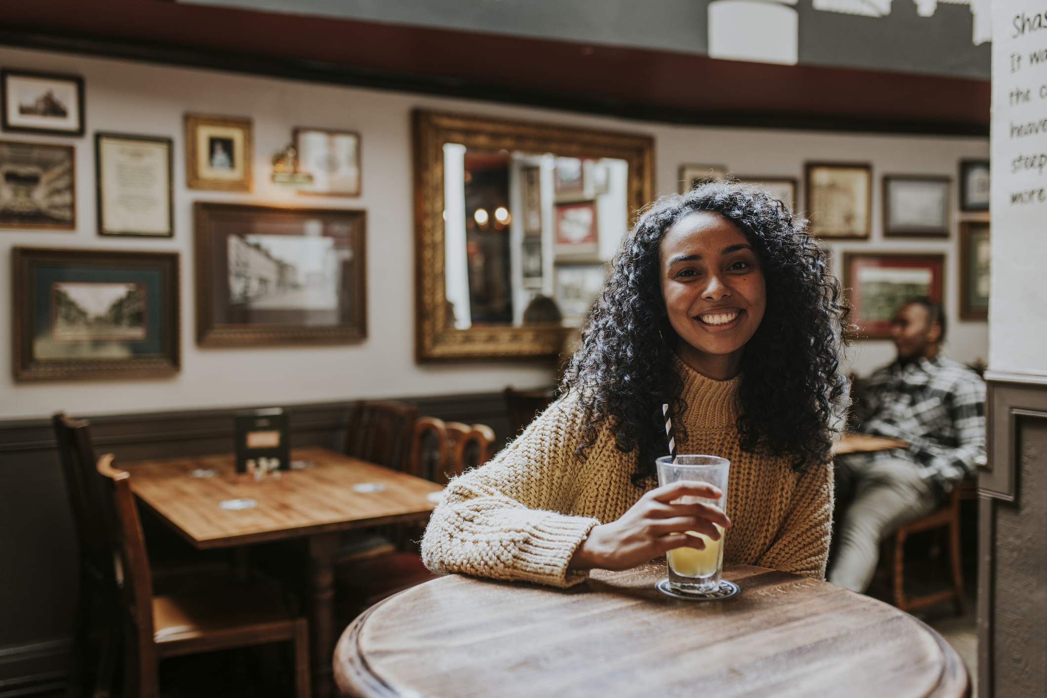 Woman sitting at a pub